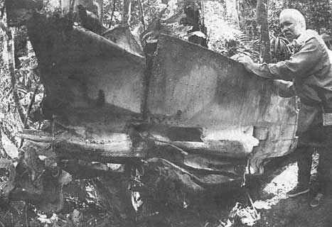 Lokman showing a wing found lying several metres from the main wreckage
